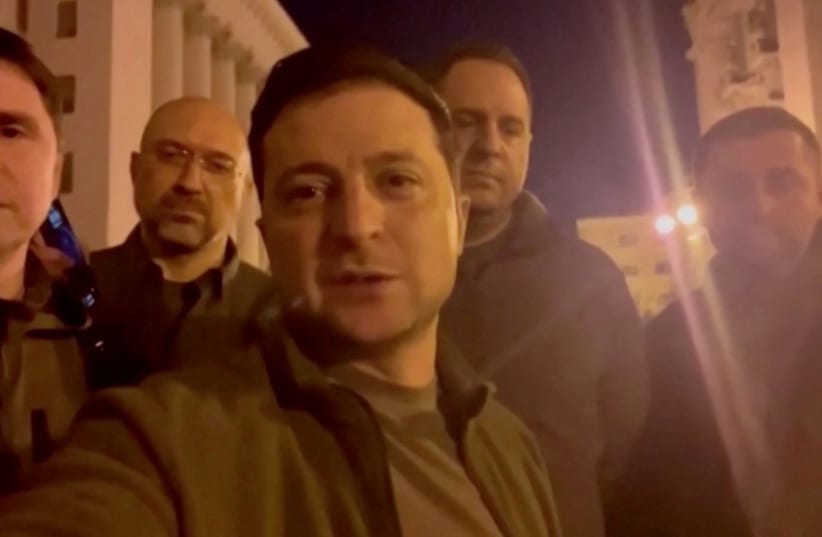  Ukrainian President Volodymyr Zelensky speaks alongside other Ukrainian officials in the governmental district of Kyiv, confirming that he is still in the capital, in Kyiv, Ukraine February 25, 2022 in this screengrab obtained from a handout video. (photo credit: Ukrainian Presidential Press Service/Handout via REUTERS)