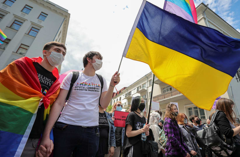 Activists hold a rally demanding state support for the local LGBTQ+ community outside the presidential office headquarters in Kyiv, Ukraine June 5, 2021 (photo credit: Serhii Nuzhnenko/Reuters)