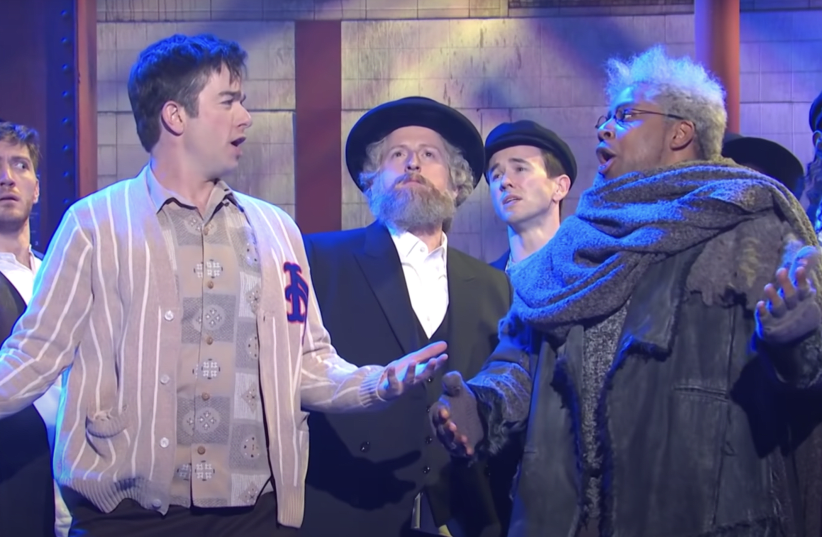  John Mulaney and Kenan Thompson perform a parody of “Fiddler on the Roof” with a chorus line of Hasidic dancers on “Saturday Night Live,” Feb. 26, 2022.  (photo credit: NBC via Youtube)