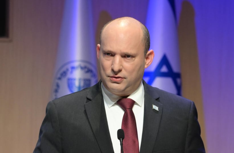  Prime Minister Naftali Bennett speaks at the Mossad, March 1, 2021 (photo credit: AMOS BEN-GERSHOM/GPO)