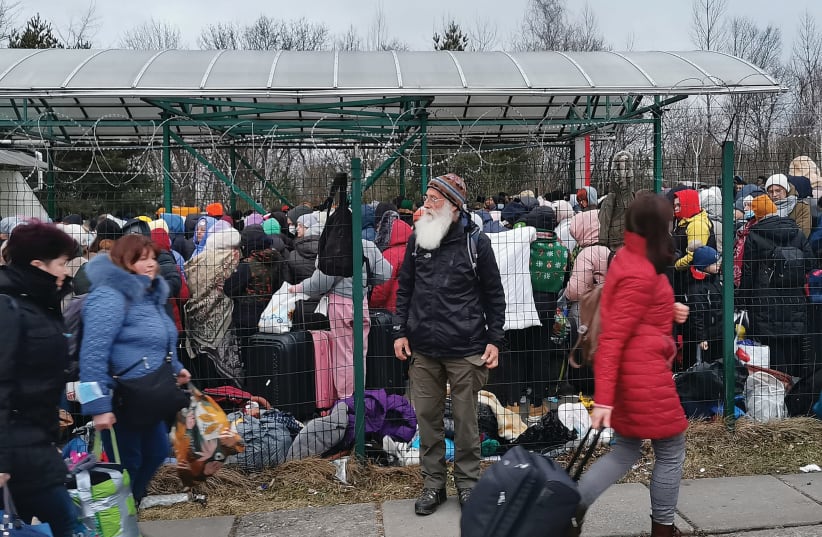  UKRAINIAN REFUGEES this week at the border with Poland in Medyka. (photo credit: Hilik Magnus/Passport Card)