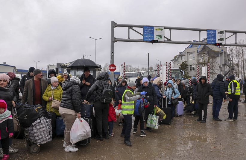  Ukrainian fleeing war zones in  Ukraine are seen at the Romanian-Ukrainian border, in Palanca Moldova, on  March 3, 2022. (photo credit: NATI SHOHAT/FLASH90)