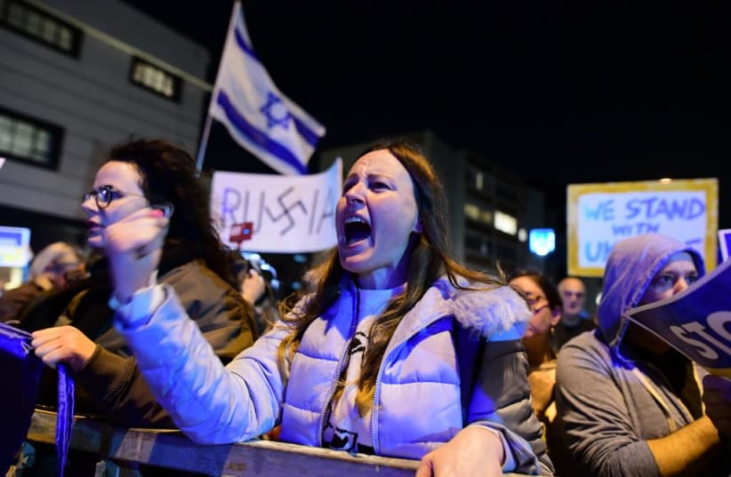  Israelis protest Russia's invasion of Ukraine in front of the Russian embassy in Tel Aviv (photo credit: AVSHALOM SASSONI/MAARIV)