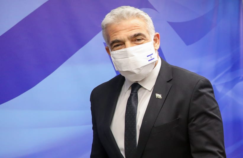  Foreign Minister Yair Lapid at the Knesset, March 6, 2022.  (photo credit: MARC ISRAEL SELLEM/THE JERUSALEM POST)
