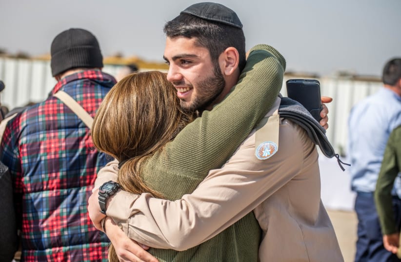  A haredi soldier is seen celebrating with family as he joins the Israeli Air Force. (photo credit: Roei Kor)