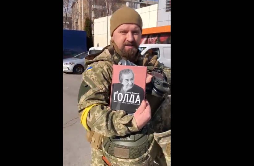  A Ukrainian soldier named Alex keeps Golda Meir's biography in his backpack.  (photo credit: SCREENSHOT/TWITTER)