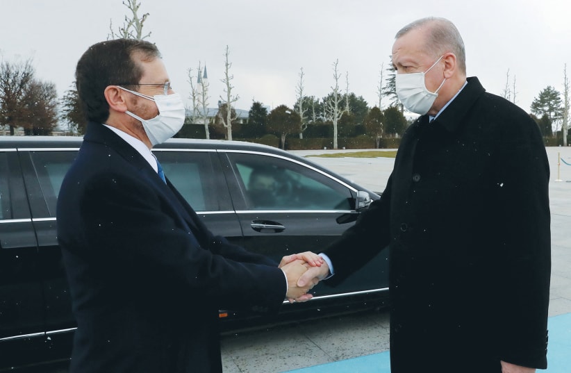  PRESIDENT ISAAC HERZOG is welcomed by Turkish President Recep Tayyip Erdogan in Ankara on Wednesday.  (photo credit: Presidential Press Unit/Reuters)
