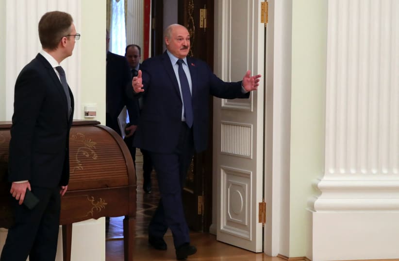  Belarusian President Alexander Lukashenko enters a hall during a meeting with Russian President Vladimir Putin at the Kremlin in Moscow, Russia March 11, 2022. (photo credit: SPUTNIK/MIKHAIL KLIMENTYEV/KREMLIN VIA REUTERS)