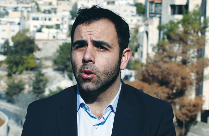  OMAR SHAKIR, a US citizen representing New York-based Human Rights Watch in Israel and the Palestinian territories, speaks to Reuters TV in Amman, 2019.  (photo credit: MUHAMMAD HAMED/REUTERS)