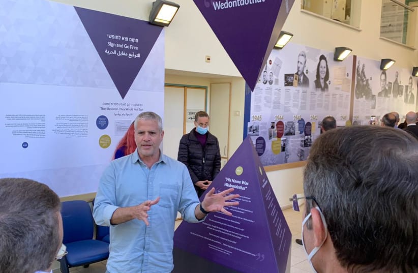  Yaron Tzur, head of the educational department at the Center for Humanistic Education of the Ghetto Fighters' House, unveils a new exhibit honoring Jehovah's Witnesses (photo credit: Trey Upshur)