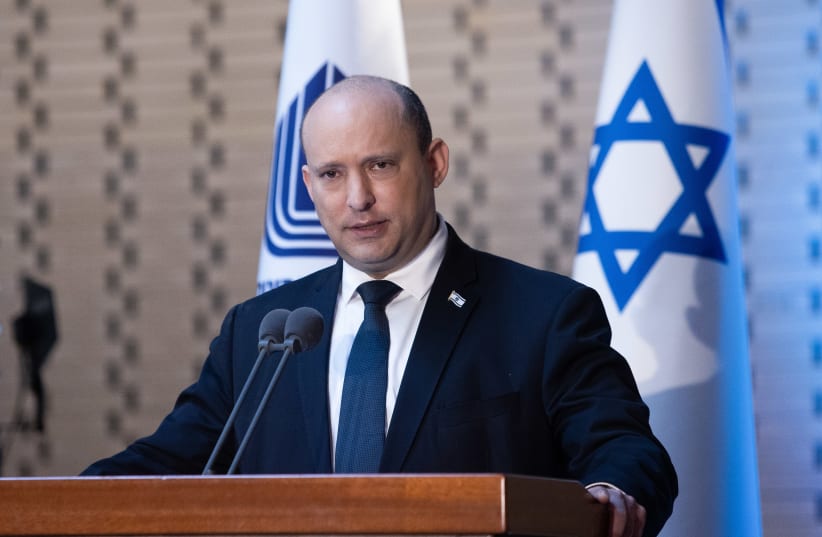  Israeli Prime Minister Naftali Bennett speaks at the annual ceremony for soldiers whose burial places are unknown, at the National Hall of Remembrance, Mount Herzl, Jerusalem, March 10, 2022. (photo credit: ALEX KOLOMOISKY/POOL)