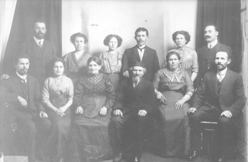  THE WRITER’S great-great grandfather is surrounded by his children. Great-grandfather Abraham Chernitsky is on the lower, far right, next to his wife Rivkah. (photo credit: Writer’s family photo collection)