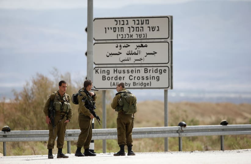  Israeli soldiers stand guard near the entrance to Allenby Bridge, a crossing point between Jordan and the West Bank (photo credit: REUTERS/Ronen Zvulun)