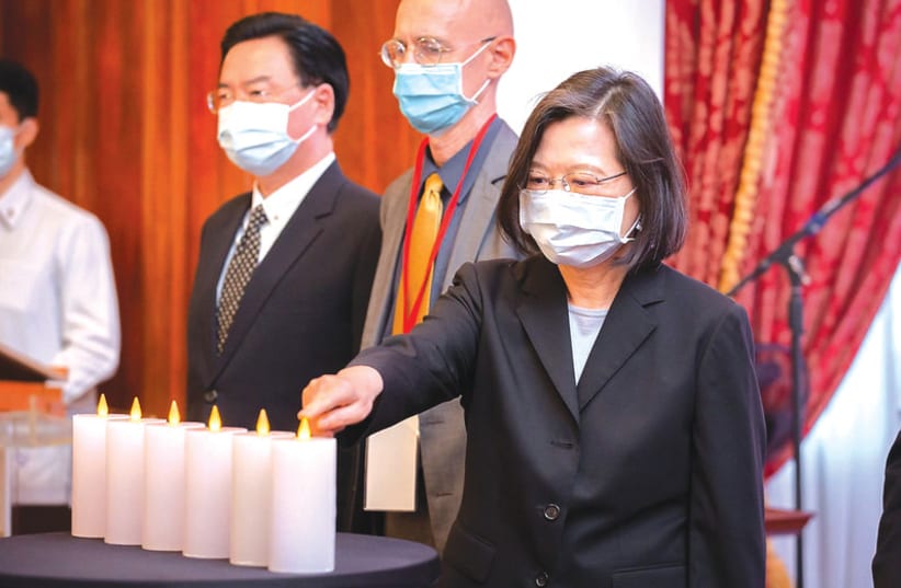  PRESIDENT TSAI ING-WEN of Taiwan lights six memorial candles at  the International Holocaust Remembrance Day ceremony in Taipei. (photo credit: Courtesy the office of the President of Taiwan)