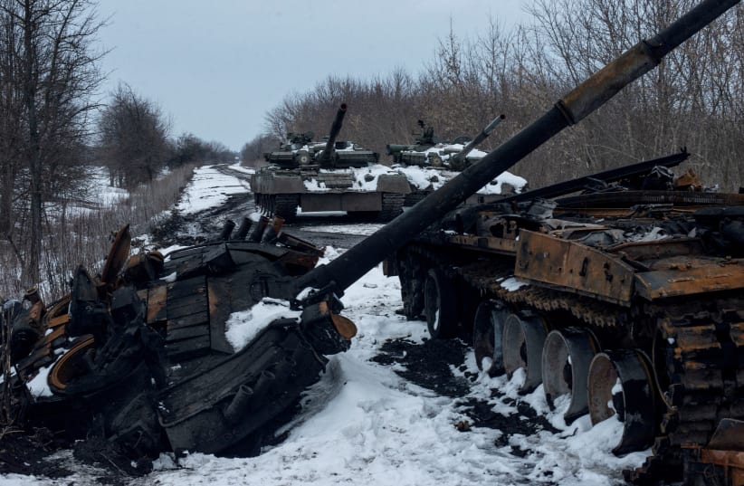  A charred Russian tank and captured tanks are seen, amid Russia's invasion of Ukraine, in the Sumy region, Ukraine, March 7, 2022. (photo credit: Irina Rybakova/Press service of the Ukrainian Ground Forces/Handout via REUTERS)
