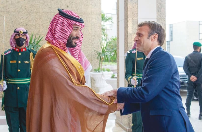  SAUDI CROWN PRINCE Mohammed bin Salman welcomes French President Emmanuel Macron to Jeddah in December. (photo credit: Saudi Royal Court/Reuters)
