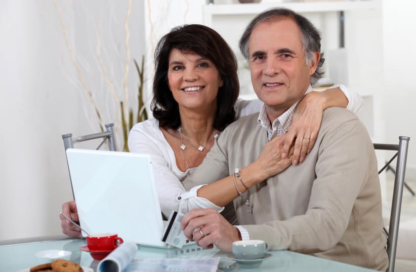  Couple purchasing on-line (photo credit: INGIMAGE)