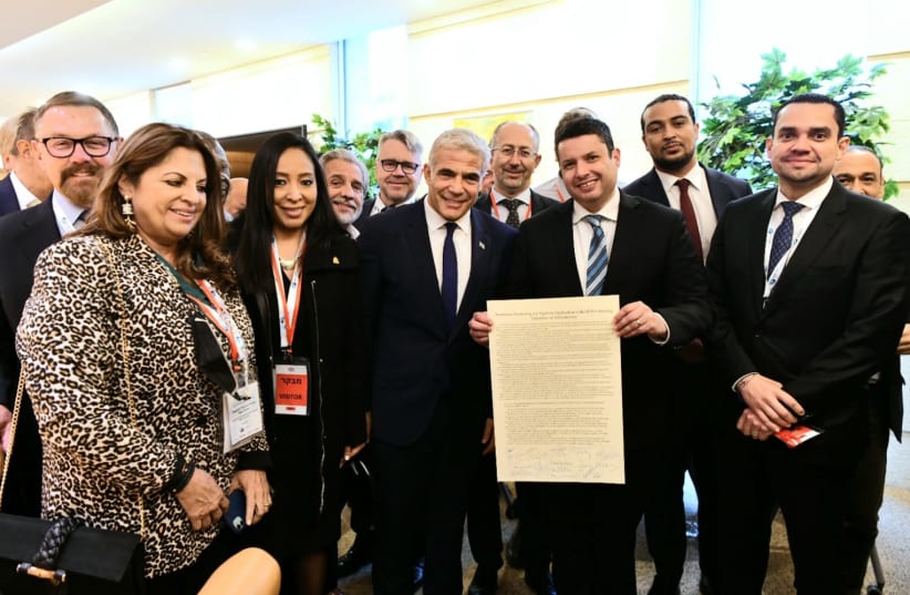  Christian MPs present Foreign Minister Yair Lapid with a declaration promoting the “vigorous application “of the IHRA working definition of antisemitism (photo credit: AVI HAYUN)