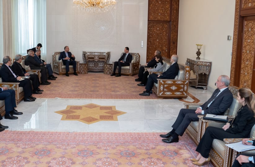  Iranian Foreign Minister Hossein Amir-Abdollahian meets with Syria's President Bashar al-Assad in Damascus, Syria, in this handout released by SANA on March 23, 2022.  (photo credit: SANA/HANDOUT VIA REUTERS)