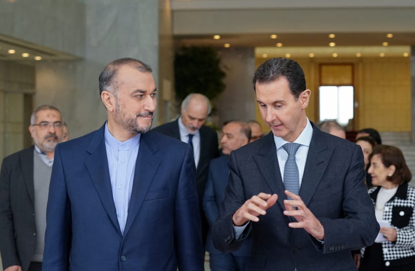  Iranian Foreign Minister Hossein Amir-Abdollahian meets with Syria's President Bashar al-Assad in Damascus, Syria, in this handout released by SANA on March 23, 2022.  (photo credit: SANA/HANDOUT VIA REUTERS)