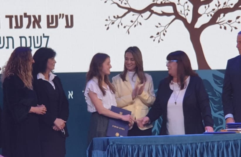  ORIYA ACCEPTING her award, with Education Minister Yifat Shasha-Biton and Dr. Tzvia Riven, Elad’s mother. (photo credit: BARBARA SOFER)