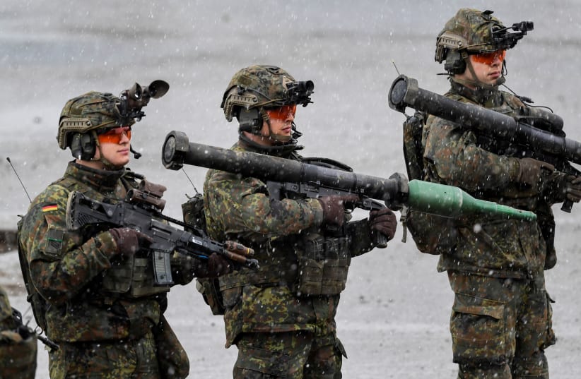  Soldiers of the German army Bundeswehr take position before a presentation during German Defence Minister Christine Lambrecht's visit to Munster military base, in Munster, Germany, February 7, 2022 (photo credit: FABIAN BIMMER / REUTERS)
