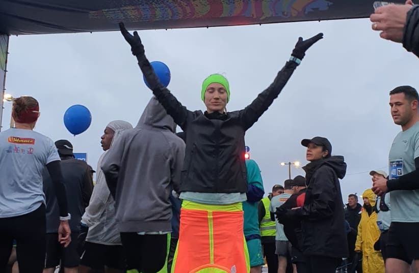  Valentina Versca, 32, escape the war in Ukraine and ran in the Jerusalem Marathon, March 25, 2022.  (photo credit: Sportphotography)