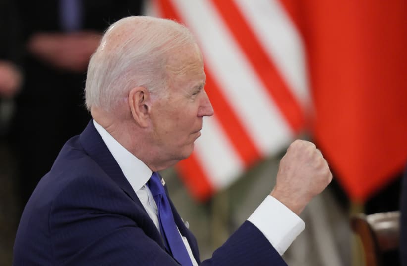  US President Joe Biden attends a bilateral meeting with the Polish Delegation (not pictured), amid Russia's invasion of Ukraine, in the Column Hall at the Presidential Palace, in Warsaw, Poland March 26, 2022. (photo credit: REUTERS/EVELYN HOCKSTEIN)