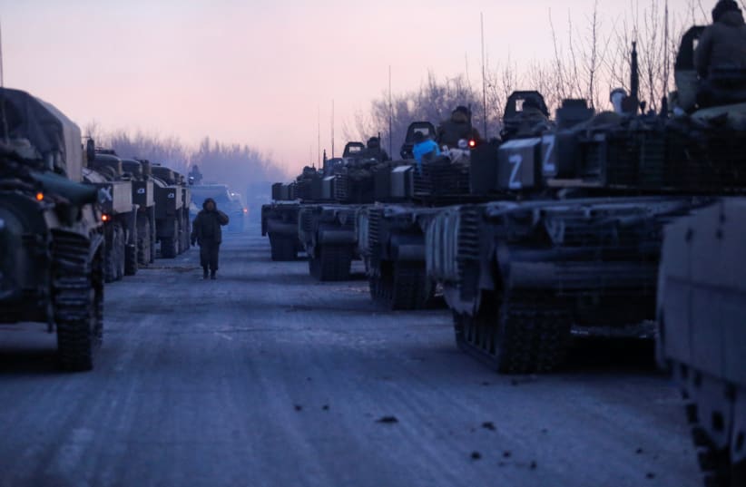  A view shows an armoured convoy of pro-Russian troops in the course of Ukraine-Russia conflict on a road leading to the besieged southern port city of Mariupol, Ukraine March 28, 2022. (photo credit: Alexander Ermochenko/Reuters)