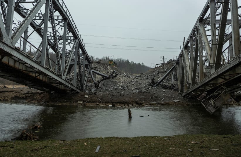  A view shows a railway bridge over the Irpin river destroyed by heavy shelling, as Russia's attack on Ukraine continues, in the town of Irpin, in Kyiv region, Ukraine March 29, 2022.  (photo credit: REUTERS/SERHII MYHALCHUK)