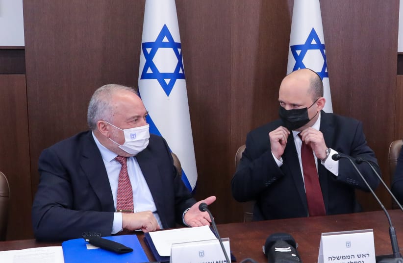  Finance Minister Avigdor Liberman chats with Prime Minister Naftali Bennett at the weekly cabinet meeting in Jerusalem on March 20. (photo credit: MARC ISRAEL SELLEM)