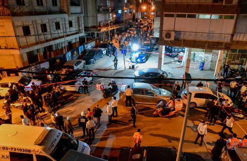  Israeli police officers and rescue forces are seen at the scene of a shooting attack in Bnei Brak, March 29, 2022. (photo credit: AVSHALOM SASSONI/FLASH90)