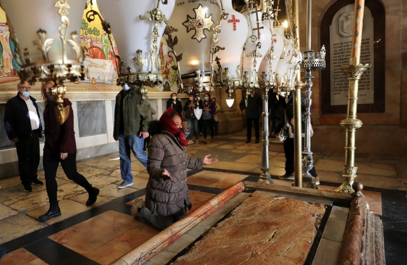 Christian worshippers mark Good Friday in Jerusalem's Old City (photo credit: AMMAR AWAD/REUTERS)