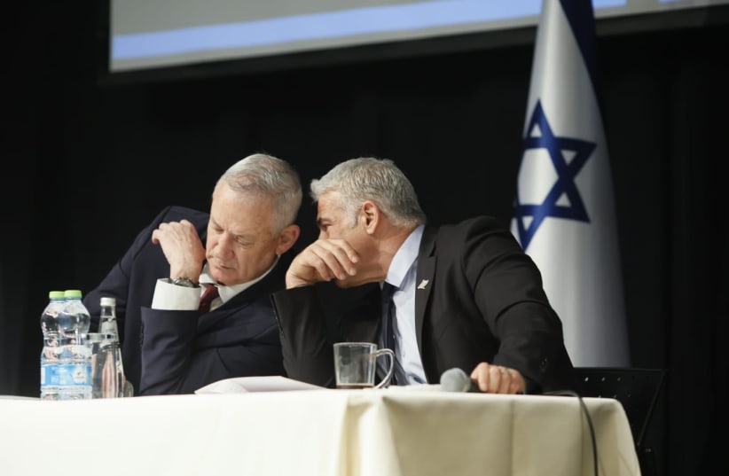  Foreign Minister Yair Lapid and Defense Minister Benny Gantz in a briefing on Iran to ambassadors from 80 countries, April 6, 2022  (photo credit: SIVAN SHACHOR)