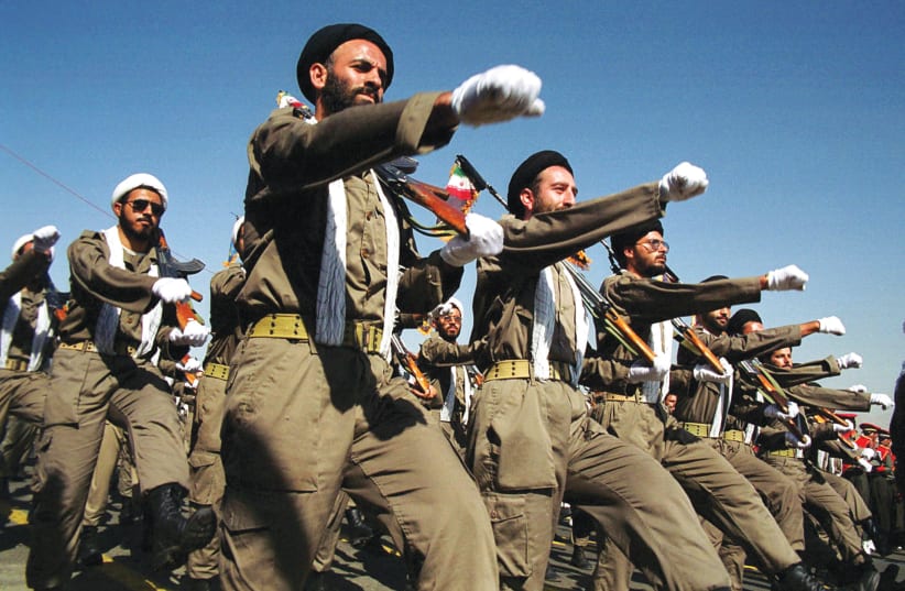  DUPING THEIR interlocutors time and again: Armed Iranian mullahs march during a military parade in Tehran. (photo credit: Atta Kenare/AFP via Getty Images)