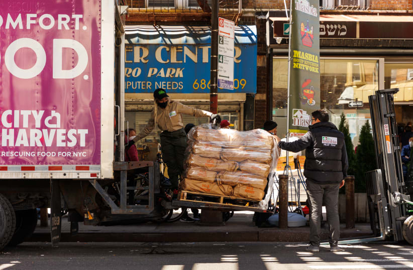  A City Harvest truck delivers pallets of kosher food to Masbia of Boro Park as part of their annual Passover Food Drive, April 11, 2022. (photo credit: Masbia/City Harvest/JTA)