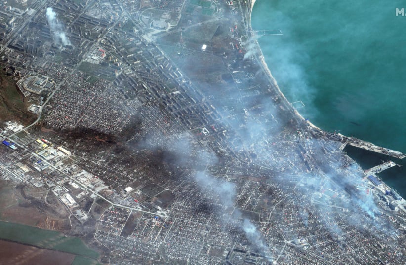 A satellite image shows buildings on fire in Mariupol, Ukraine, April 9, 2022. (photo credit: MAXAR TECHNOLOGIES/HANDOUT VIA REUTERS)