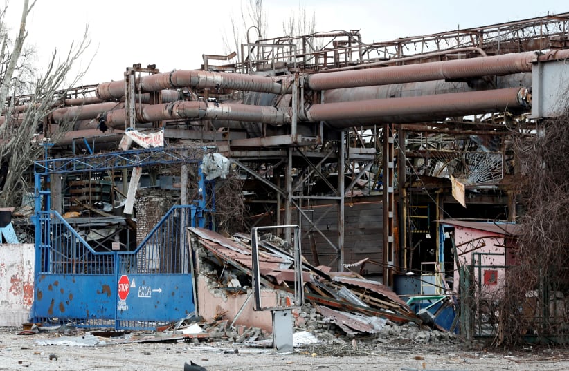  A view shows the gates of the Illich Steel and Iron Works damaged during Ukraine-Russia conflict in the southern port city of Mariupol, Ukraine April 15, 2022.  (photo credit: REUTERS/Alexander Ermochenko/File Photo)