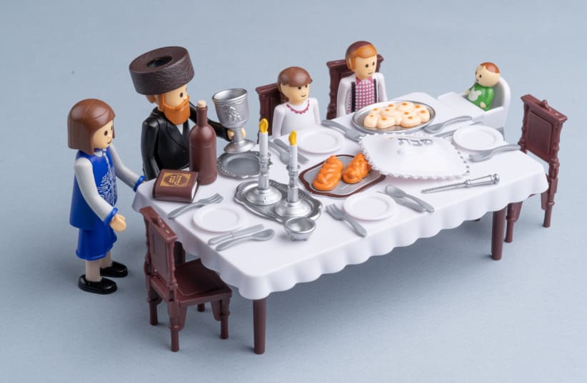  A "Shabbos Table" set from Kids Play depicts a typical haredi Orthodox family at home. The designer, Shlomi Eiger, says the brand is part of a "contemporary trend of Haredi children's toys and games designed from within the community." (photo credit: OMAR FRIEDMAN)