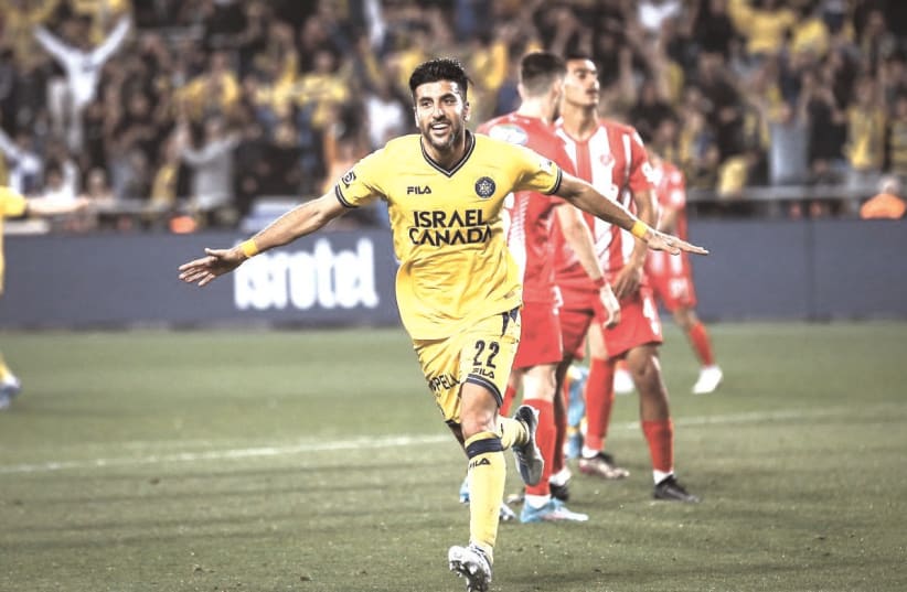 MACCABI TEL AVIV midfielder Avi Rikan scored two goals and assisted on another in the yellow-and-blue’s 5-0 derby victory over Hapoel at Bloomfield. (photo credit: MACCABI TEL AVIV/COURTESY)