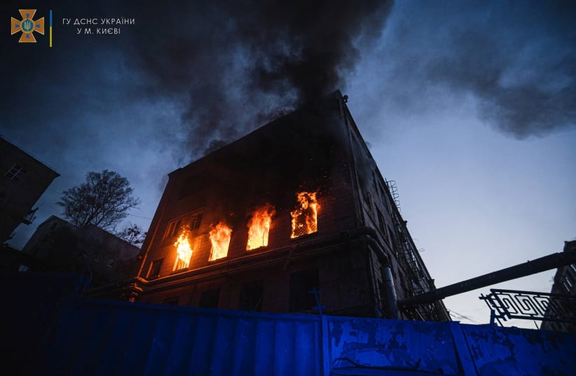  Fire burns in a building damaged by a missile strike, as Russia's attack on Ukraine continues, in Kyiv, Ukraine, in this handout picture released on April 29, 2022. (photo credit: Press service of the State Emergency Service of Ukraine/Handout via REUTERS)