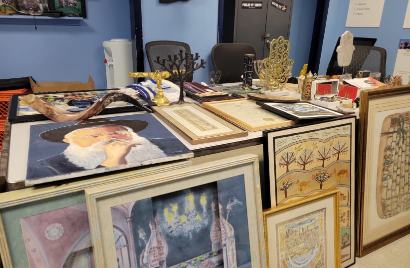  Police recovered several bins of Judaica from the house of Pittsburgh resident Andrew Clinton, April 21, 2022.  (photo credit: DAVID RULLO/PITTSBURGH JEWISH CHRONICLE)