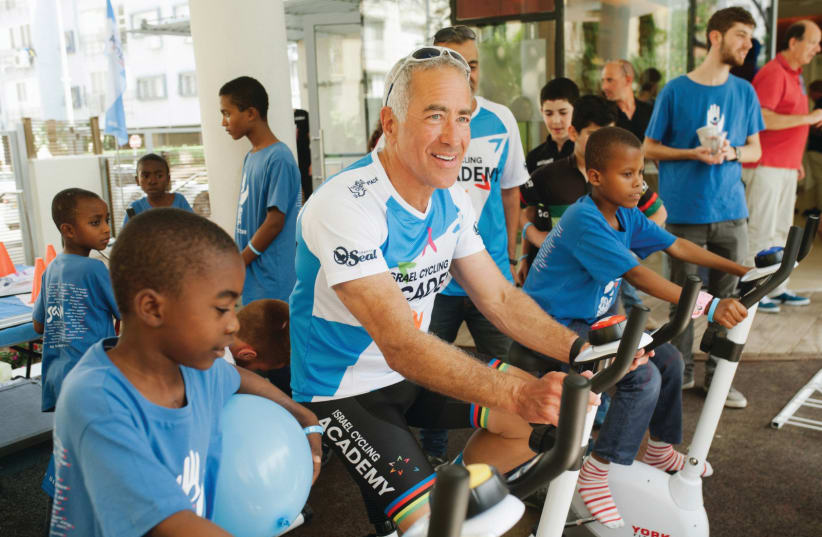  SYLVAN ADAMS exercises with children from Save a Child’s Heart. (photo credit: SAVE A CHILD'S HEART)