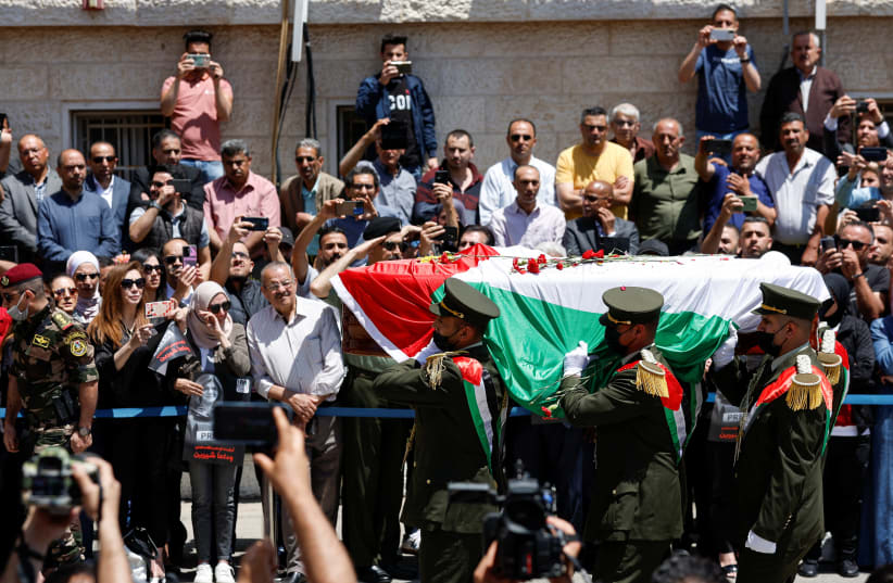  Palestinians bid farewell to Al Jazeera journalist Shireen Abu Akleh, who was killed during a live fire exchange between Palestinians and IDF in Jenin, in Ramallah in the West Bank May 12, 2022.  (photo credit: REUTERS/MOHAMAD TOROKMAN)