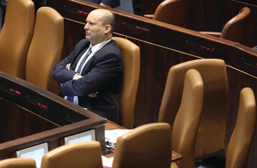  PRIME MINISTER Naftali Bennett sits in the Knesset this week.  (photo credit: MARC ISRAEL SELLEM/THE JERUSALEM POST)