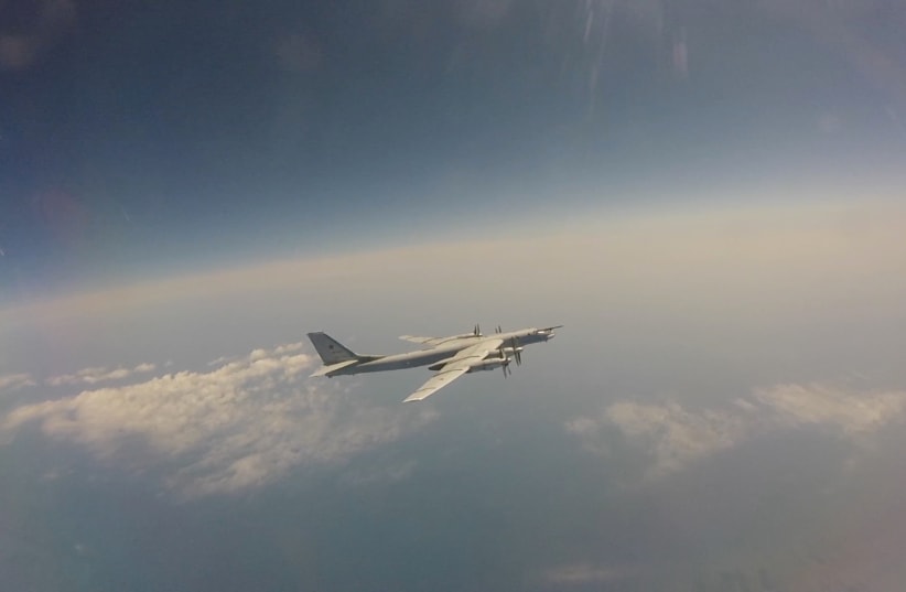  Russian Tu-95 strategic bomber flies during Russian-Chinese military aerial exercises to patrol the Asia-Pacific region, at an unidentified location, in this still image taken from a video released May 24, 2022. (photo credit: Russian Defence Ministry/Handout via REUTERS)