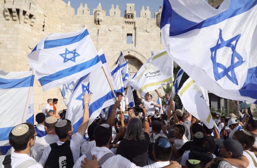  Israelis take part in Jerusalem Day flag march in front of Damascus Gate, May 29, 2022 (photo credit: MARC ISRAEL SELLEM)
