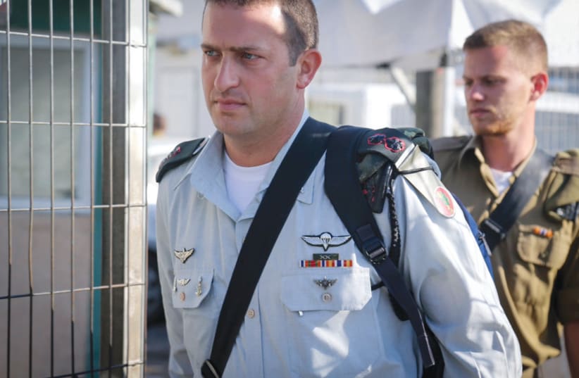  LT.-COL. DAVID SHAPIRA arrives at the Jaffa Military Court in 2016. Shapira testified that he doubted that Elor Azaria, a soldier under his command, was in danger when Azaria killed a terrorist in Hebron who was already shot and lying on the ground.  (photo credit: FLASH90)