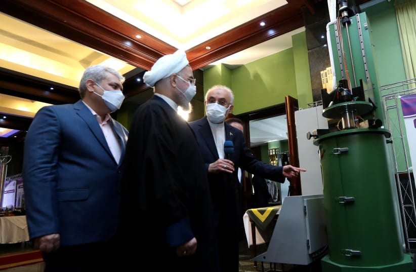  Iranian President Hassan Rouhani reviews Iran's new nuclear achievements during Iran's National Nuclear Energy Day in Tehran, Iran April 10, 2021. (photo credit: IRANIAN PRESIDENCY OFFICE/WANA (WEST ASIA NEWS AGENCY)/HANDOUT VIA REUTERS)
