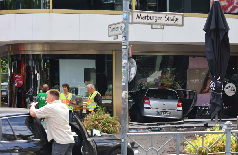  View of the car that crashed into a group of people before hitting a storefront at Tauentzienstrasse in Berlin, Germany June 8, 2022. (photo credit: REUTERS/FABRIZIO BENSCH)